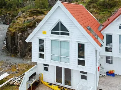 a white house being built on a dock at 6 person holiday home in Urangsvåg in Steinsbø