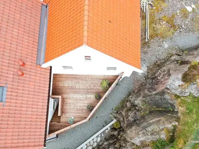 an overhead view of a building with an orange roof at 6 person holiday home in Urangsvåg in Steinsbø