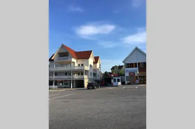 a view of a parking lot with a building at Balestrand Fjordapartments Holmen 19A in Balestrand