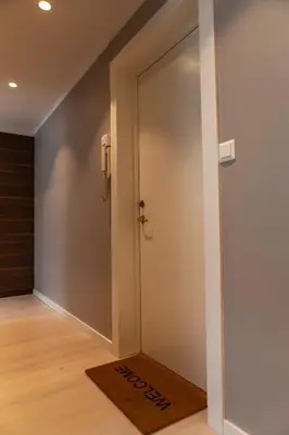 a sliding door in a room with a mat at Forenom Serviced Apartments Bergen City in Bergen