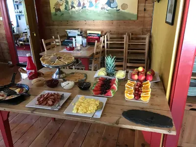 a table with many different types of food on it at Eidfjord Hytter in Eidfjord
