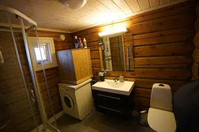 a bathroom with a sink and a toilet and a mirror at Lake View Apartment 2 bedrooms and loft in Stranda