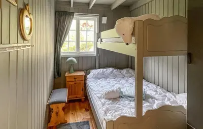 a bedroom with a bunk bed with a teddy bear on it at Lovely Home In Rendalen With Wifi in Rendalen