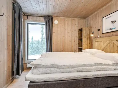 a bedroom with two beds in a room with a window at 10 person holiday home in Fåvang in Favang