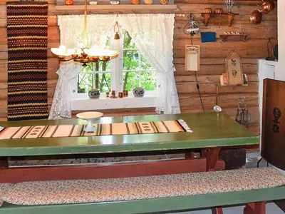 a dining room with a table and a window at Vintage Charm by the Sea-By Traum in Bø