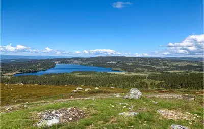 a view of a lake from the top of a hill at 4 Bedroom Beautiful Home In Sjusjøen in Sjusjøen