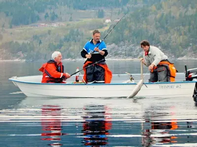 three people in a boat on the water at 5 person holiday home in EIDSVÅG in Eidsvåg