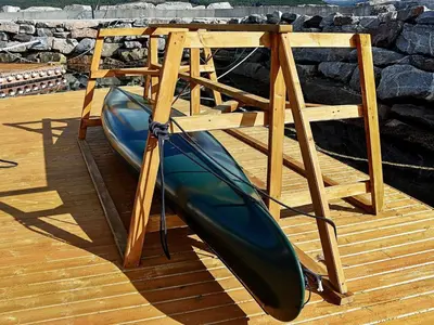 a canoe sitting on top of a wooden deck at 5 person holiday home in EIDSVÅG in Eidsvåg