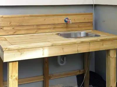 a wooden counter with a sink on a wall at 10 person holiday home in MIDSUND in Midsund