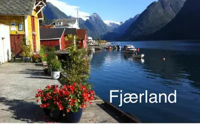 a view of a lake with boats in the water at Two bedroom apartement in Sogndal