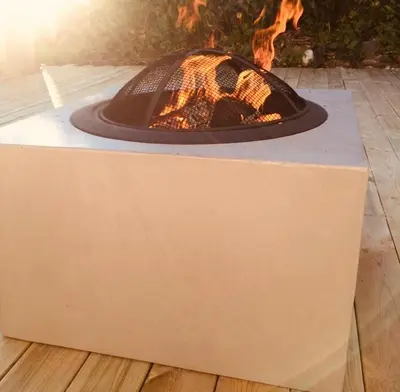 a fire pit with a fire pit at The Gingerbread House in Lillehammer