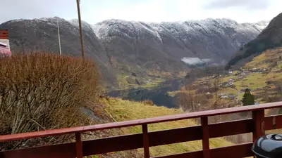 a view of a valley with a snow covered mountain at Leilighet 2240 in Haugsvær