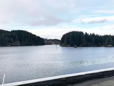 a large body of water with trees in the background at 6 person holiday home in Seim in Seim