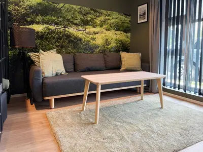 a living room with a couch and a coffee table at Apartment Lilletveitvegen in Bergen