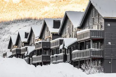 a large building covered in snow in the snow at Tinden in Hemsedal