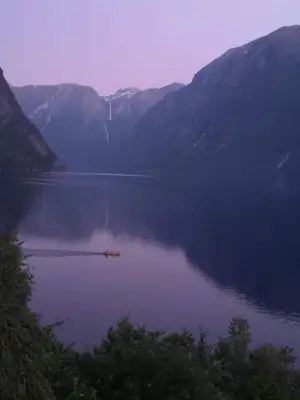a view of a lake with mountains in the background at Iris Vedal in Nauste