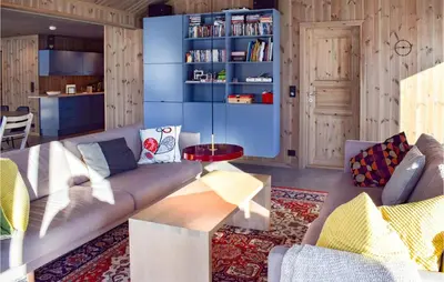 a living room with a couch and a table at Amazing Home In Flå With Wifi in Flå
