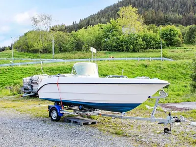 a boat on a trailer on the side of a road at 8 person holiday home in VATNE in Vatne