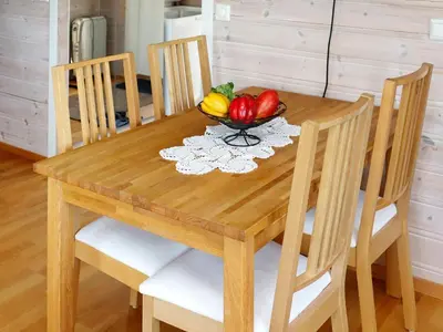 a wooden table with a bowl of vegetables on it at 7 person holiday home in KLOKKARVIK in Klokkarvik