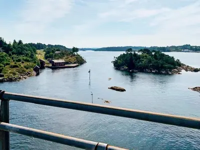 a view of a river from a bridge at 6 person holiday home in Austrheim in Utkeila