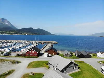 an aerial view of a marina with boats at Aursnes Hotell in Sykkylven