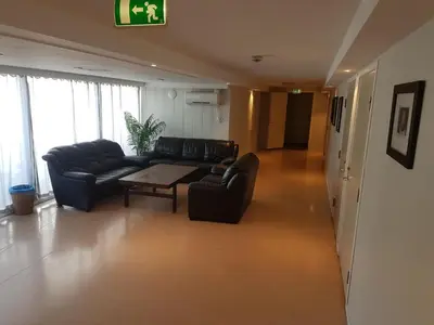a living room with a couch and a table at Folgefonn Gjestetun in Jondal