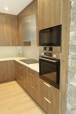 a kitchen with a stove and a microwave at Olden Panorama Apartments - Fjord view - High Standard in Olden
