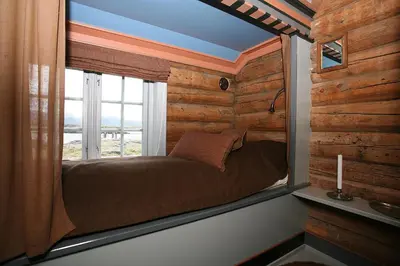 a bedroom with a window with a bed in it at Korsholmen - by Classic Norway Hotels in Karvåg