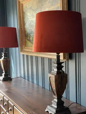 a table with two lamps on top of a dresser at Moldegaard Farmhouse - Apartment A in Moldegard