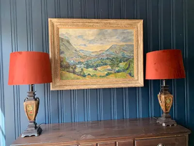 two lamps sitting on top of a table with a painting at Moldegaard Farmhouse - Apartment A in Moldegard