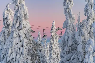a ski lift with trees covered in snow at Villa Sole, Trysil in Trysil