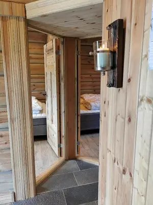 a small room with two beds in a cabin at Liaplassen Mountain View in Beitostøl