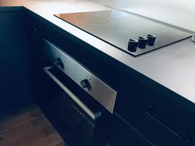 a blue cabinet with a sink in a kitchen at Ski and Bike-In and Out in Hafjell