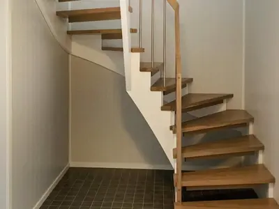 a staircase in a house with wooden steps at 6 person holiday home in Dyrvik in Dyrvik