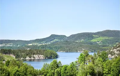 a view of a lake with mountains in the background at 3 Bedroom Awesome Home In Skjold in Skjold