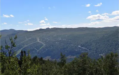 a view of a valley in the mountains with trees at 3 Bedroom Amazing Home In Uvdal in Uvdal