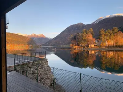 a view of a lake with mountains in the background at Stryn Crystal Apartments - Waterfront Apartment in Stryn