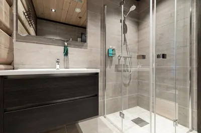 a bathroom with a sink and a shower at Skigaarden in Hemsedal