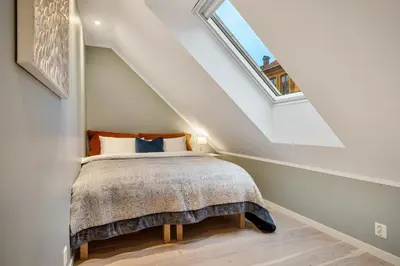 a bedroom with a bed in a attic at Keyser Apartments 8 in Bergen