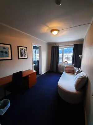 a hotel room with a bed and a window at Sunndalsøra Hotell in Sunndalsøra
