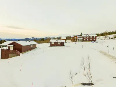 an aerial view of a farm in the snow at Nordpå Fjellhotell AS in Haltdalen