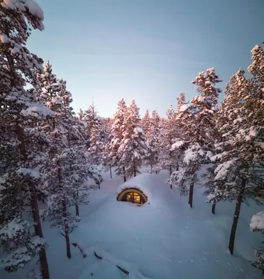 a cabin in the middle of a snowy forest at Eventyrhyttene i Jotunheimen in Stuttgongfossen