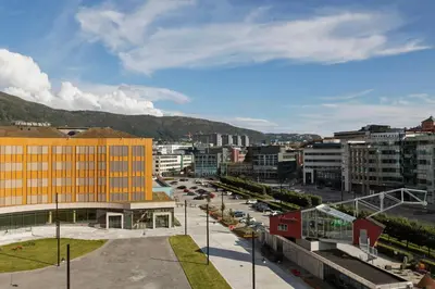 a view of a city with buildings and a street at Moxy Bergen in Bergen