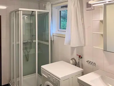 a bathroom with a shower and a sink at 6 person holiday home in Brekke in Brekke