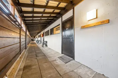 an empty hallway of a building with a wooden ceiling at Stor barnevennlig leilighet in Hovden