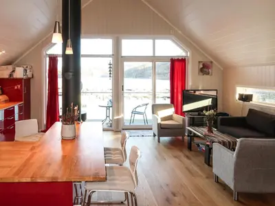 a living room with a couch and a table at Holiday Home Jektastøo by Interhome in Nordhuglo
