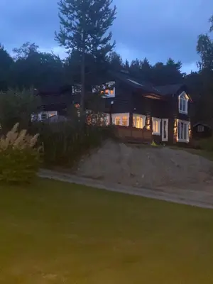 a house with a tree in front of it at Villa Solsiden Geilo in Geilo