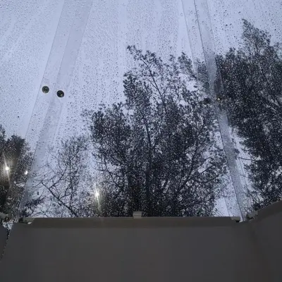 a view of a window with rain on the glass at Glassigloo med panoramautsikt - Nordlys og stjernehimmel - Fosen in Husby