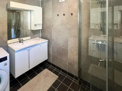 a bathroom with a sink and a shower at 8 person holiday home in Svelgen in Svelgen
