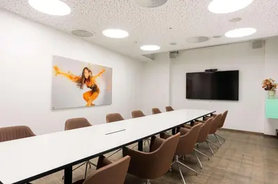 a conference room with a long table and chairs at Scandic Ørnen in Bergen